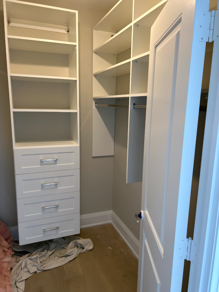 studio apartment closet with sliding mirror door