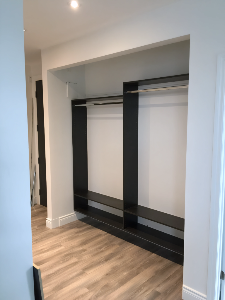 cozy wood closet system with bench seating