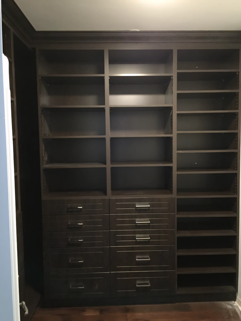 closet system with cubbies, drawers, and hangers