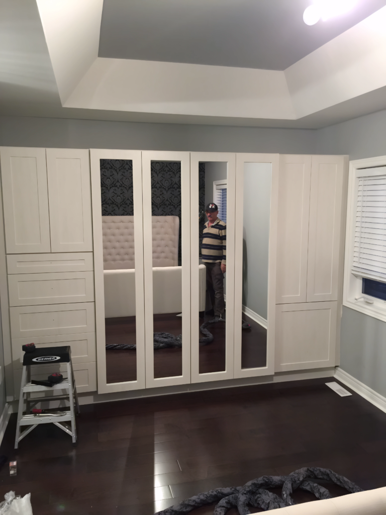 bedroom wall closet with open storage solution
