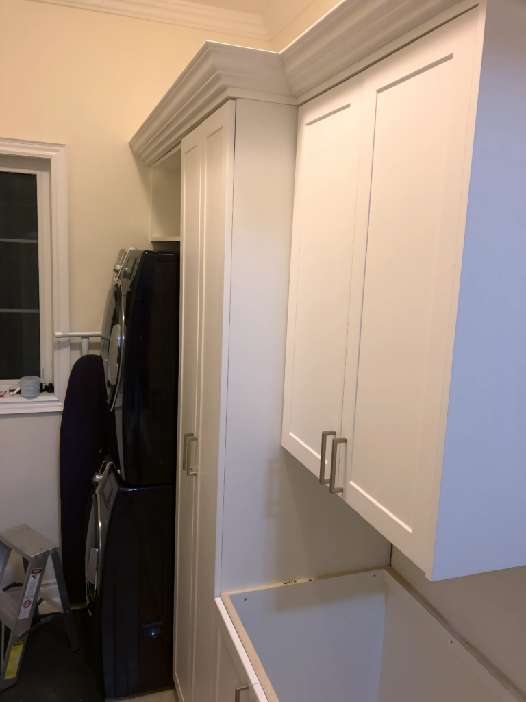 compact utility closet with overhead storage
