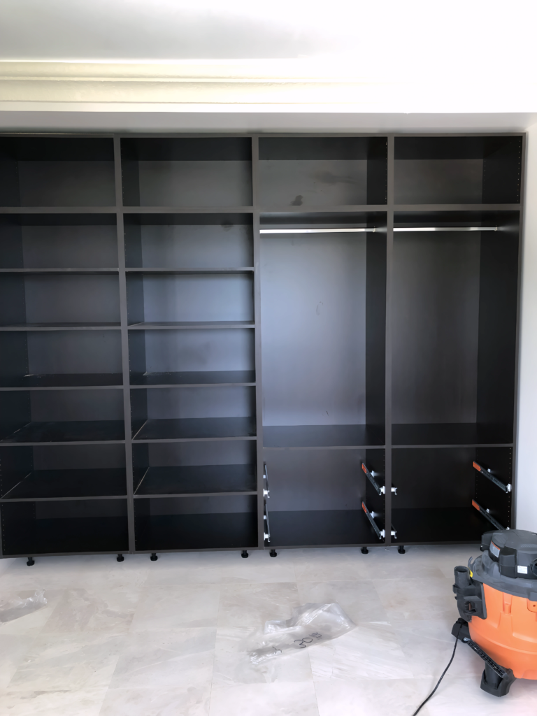 wardrobe with pull-down rods for easy access
