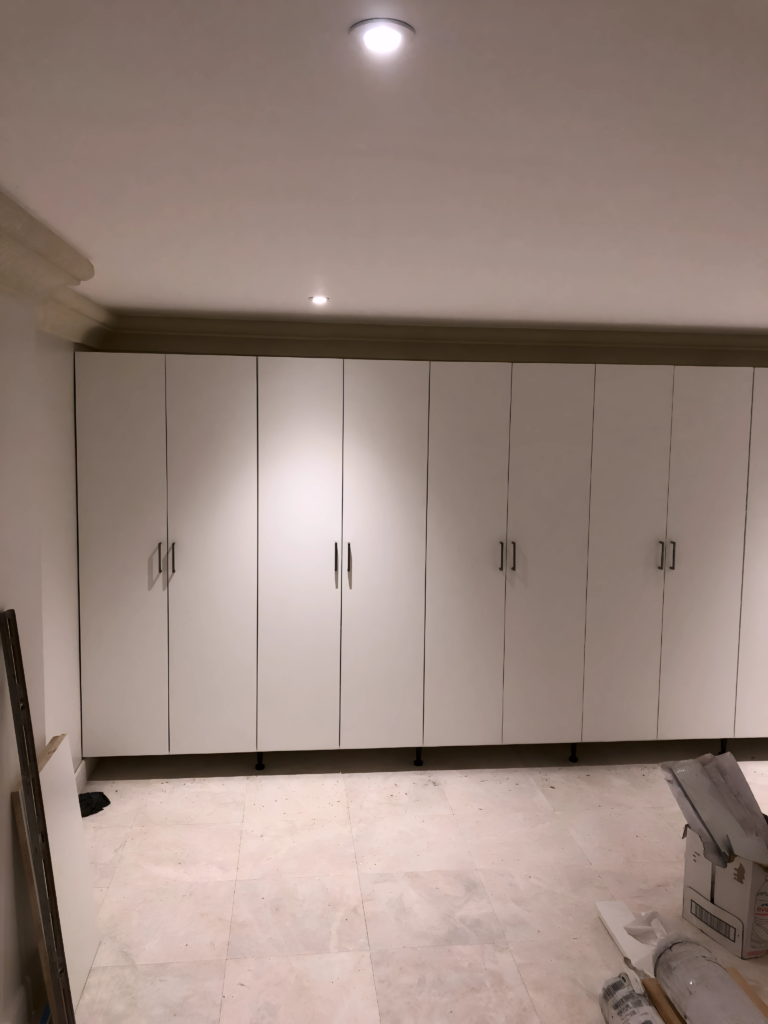 soft-close drawers in white closet installation