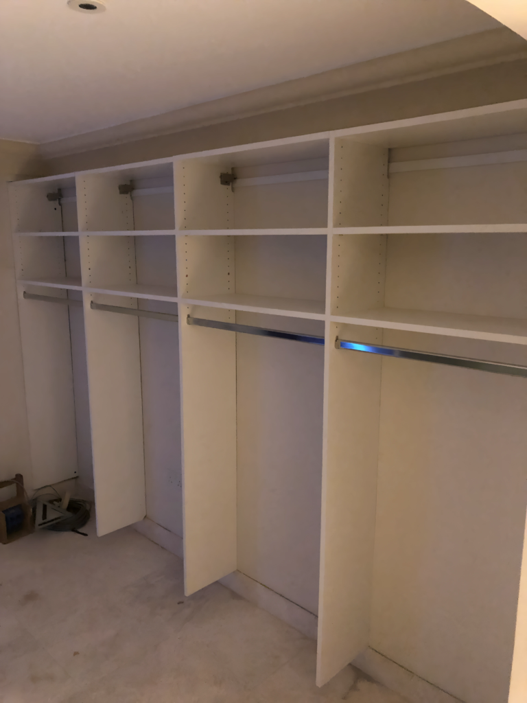 hallway cabinet system with coat hooks and cubbies